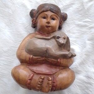 Chinese wood carved girl. 8 1/2 " H X 5 1/2" W.